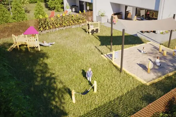 Ein zur Kinderkrippe umfunktioniertes Reihenhaus mit Garten. Im Garten mehrere Robinienspielgeräte